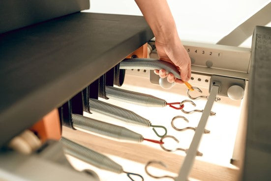 Choosing the Best Pilates Reformer Accessories: Studio Must-Haves