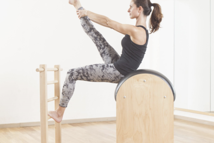 pilates ladder barrel demo exercise by a studio owner